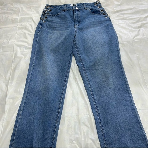 Forever21 denim blue jeans with grommets and chains on each side. - Picture 1 of 6